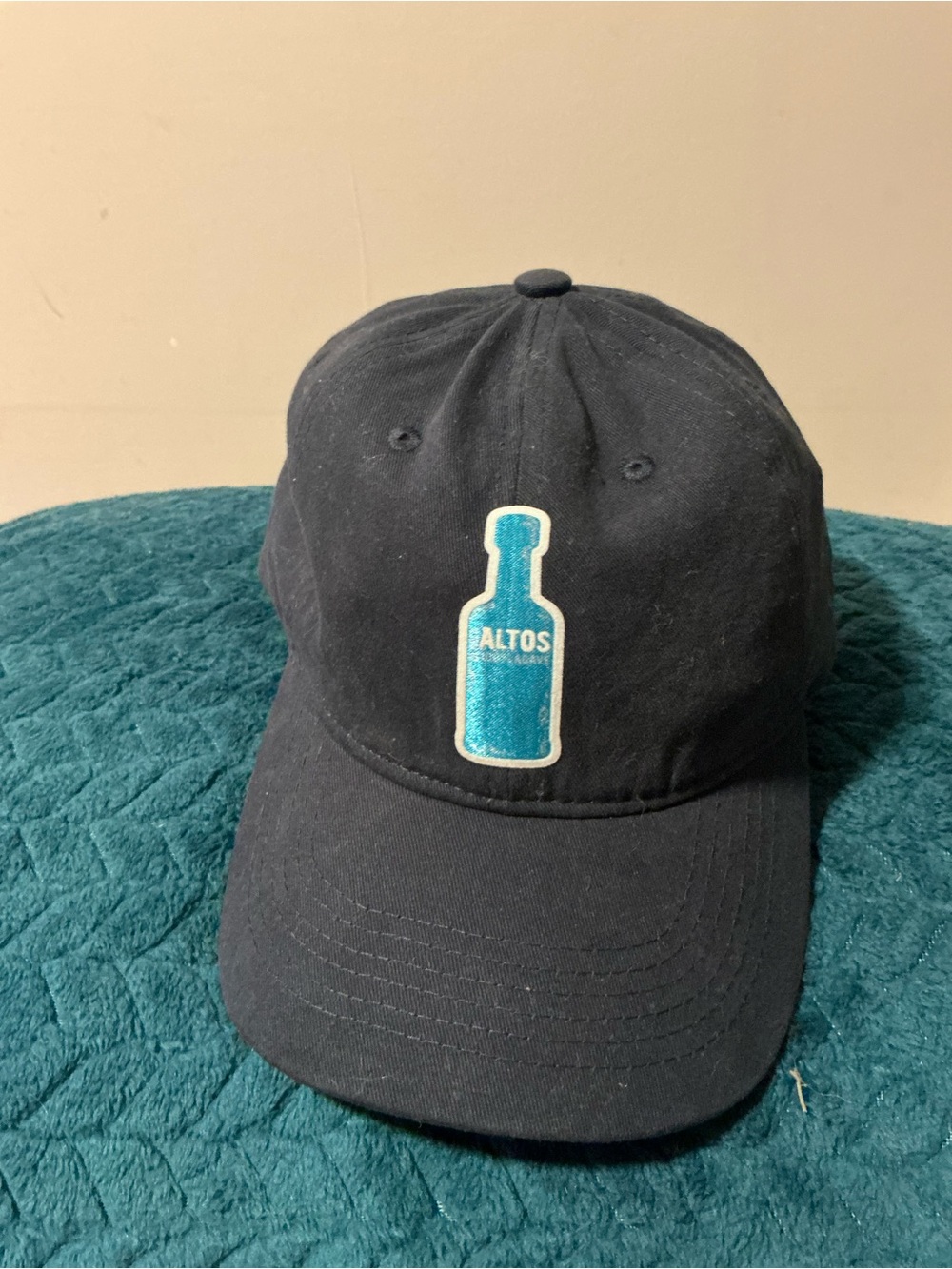 Black Baseball Cap with Teal Bottle Patch